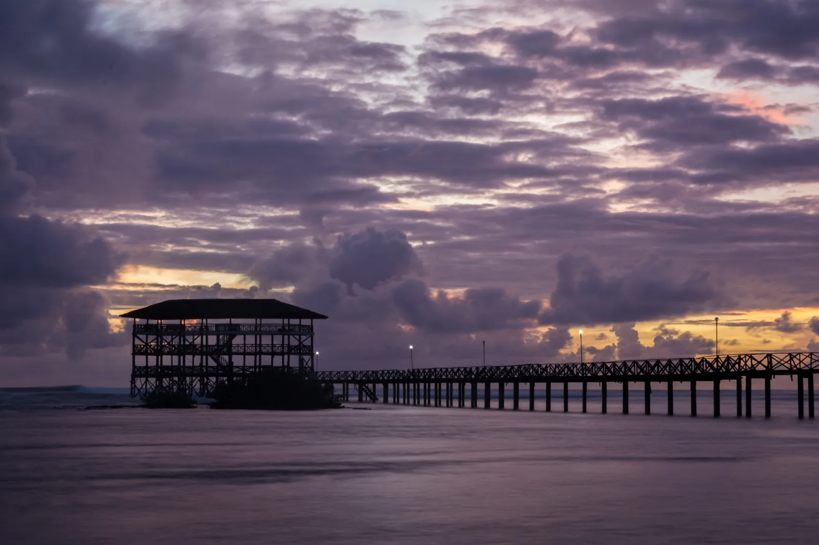 Cloud 9 boardwalk beneath a cloudy sky in Siargao